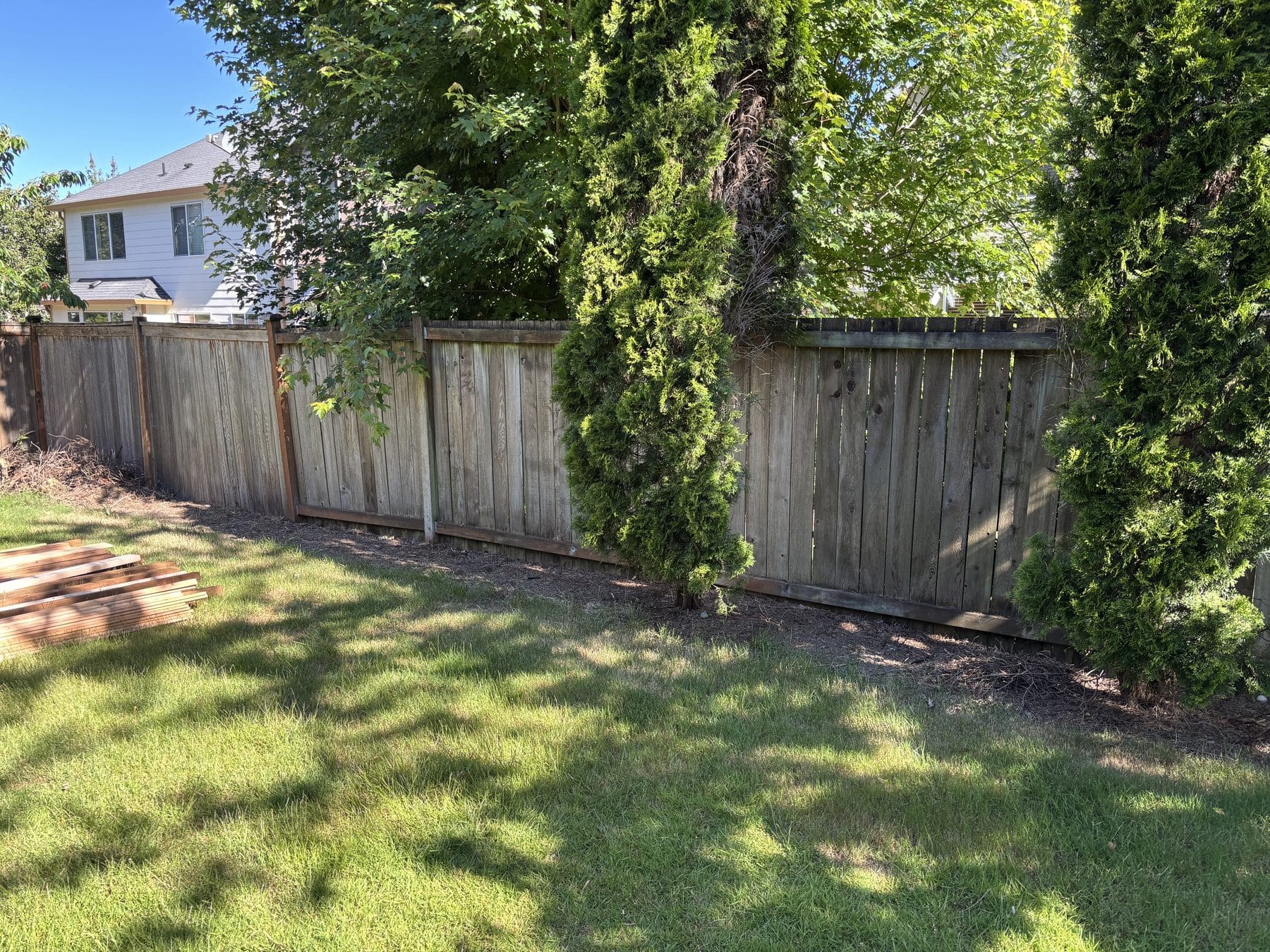 Weathered wood fence before replacement in Bothell WA