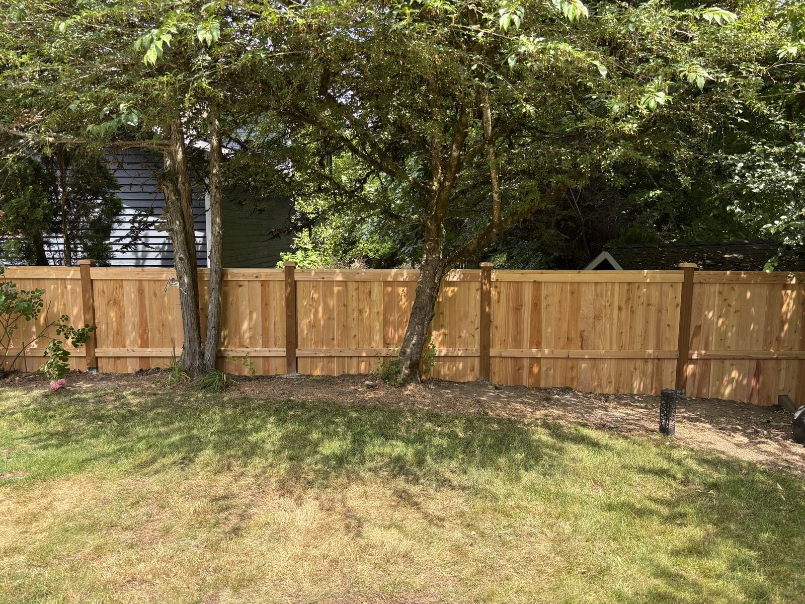 Completed 45 foot full-panel cedar privacy fence in Sammamish Washington