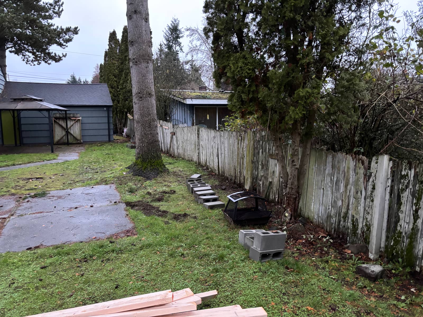 Old weathered fence before replacement in Seattle