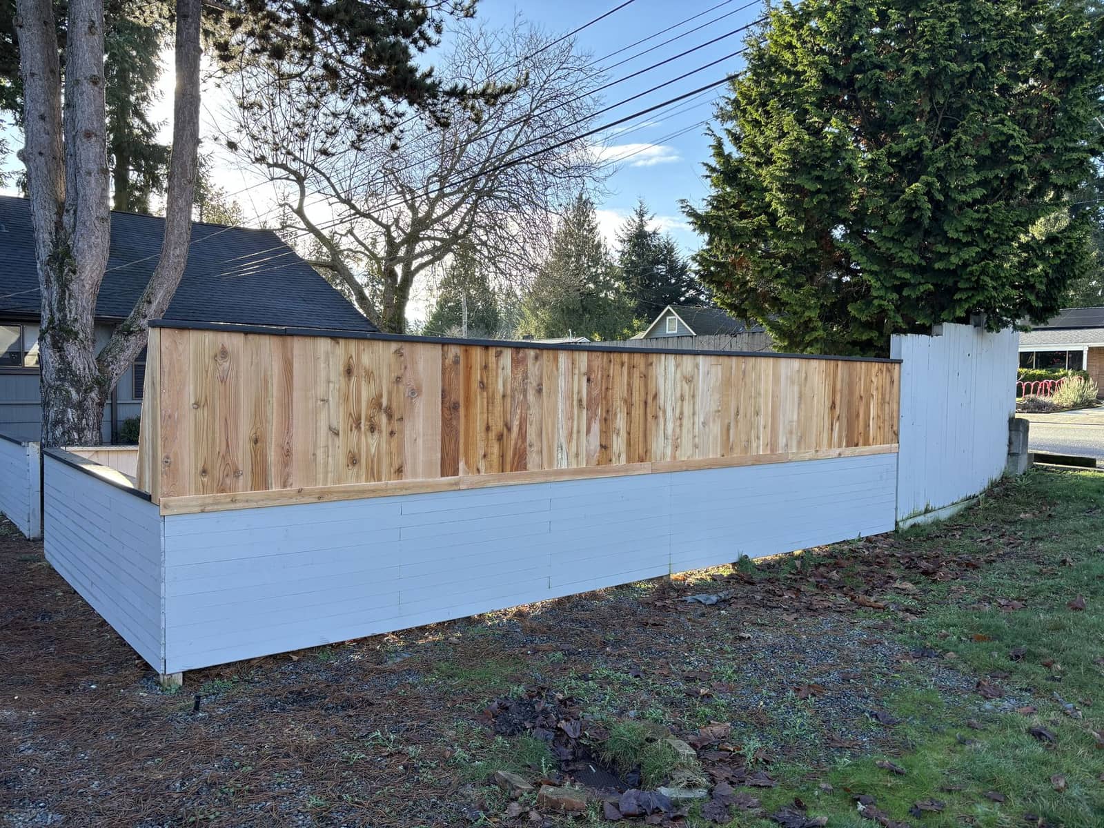 Existing half-height fence raised to six feet after repair